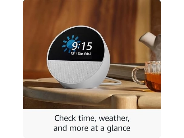 Echo Spot blanco ubicado sobre una mesa de noche como despertador elegante y funcional.